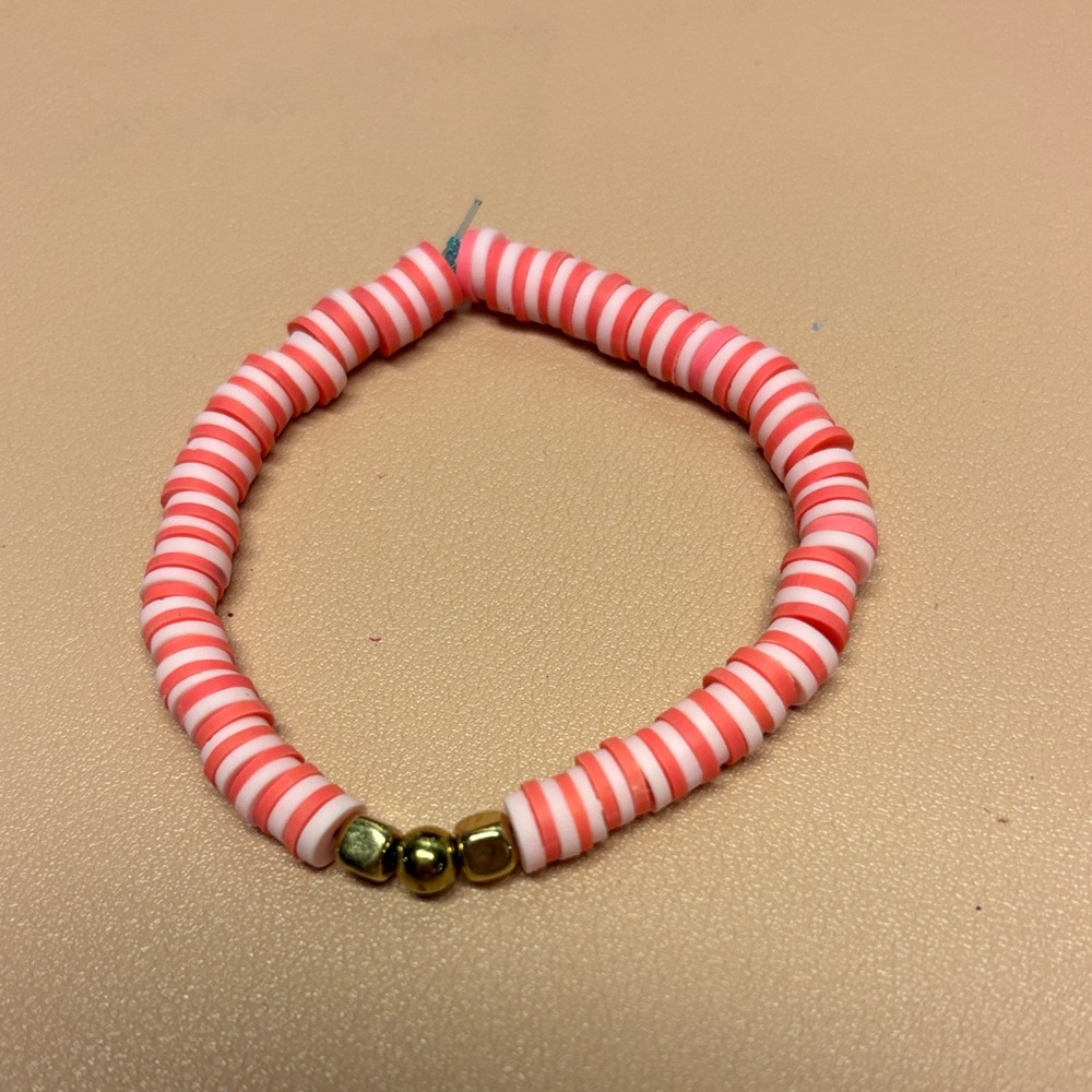 Red and White Beaded Bracelet with Gold Accents